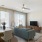 a living room with a table and chairs