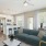 a living room with a blue couch