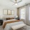a bedroom with a bed and a fan